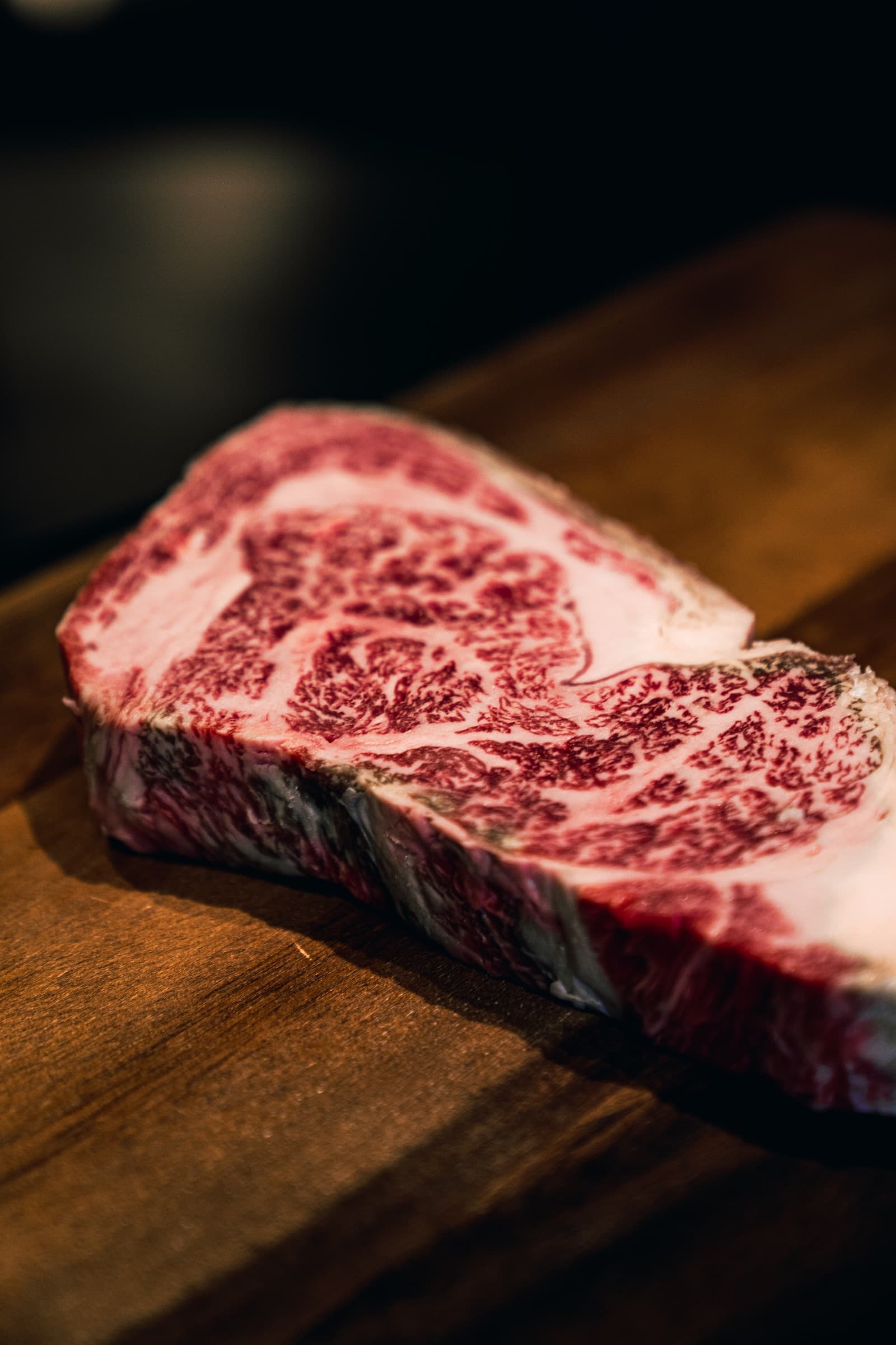 Marbled Tajima Wagyu sirloin on a wooden board at Aragawa